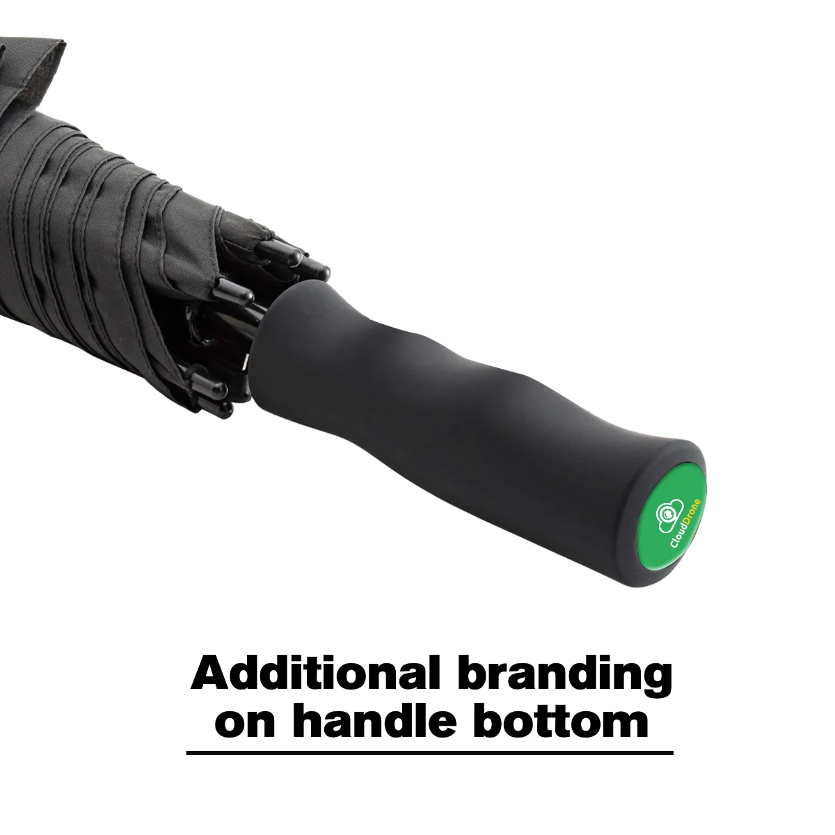 Branded logo badge set into the end cap at the bottom of an umbrella handle