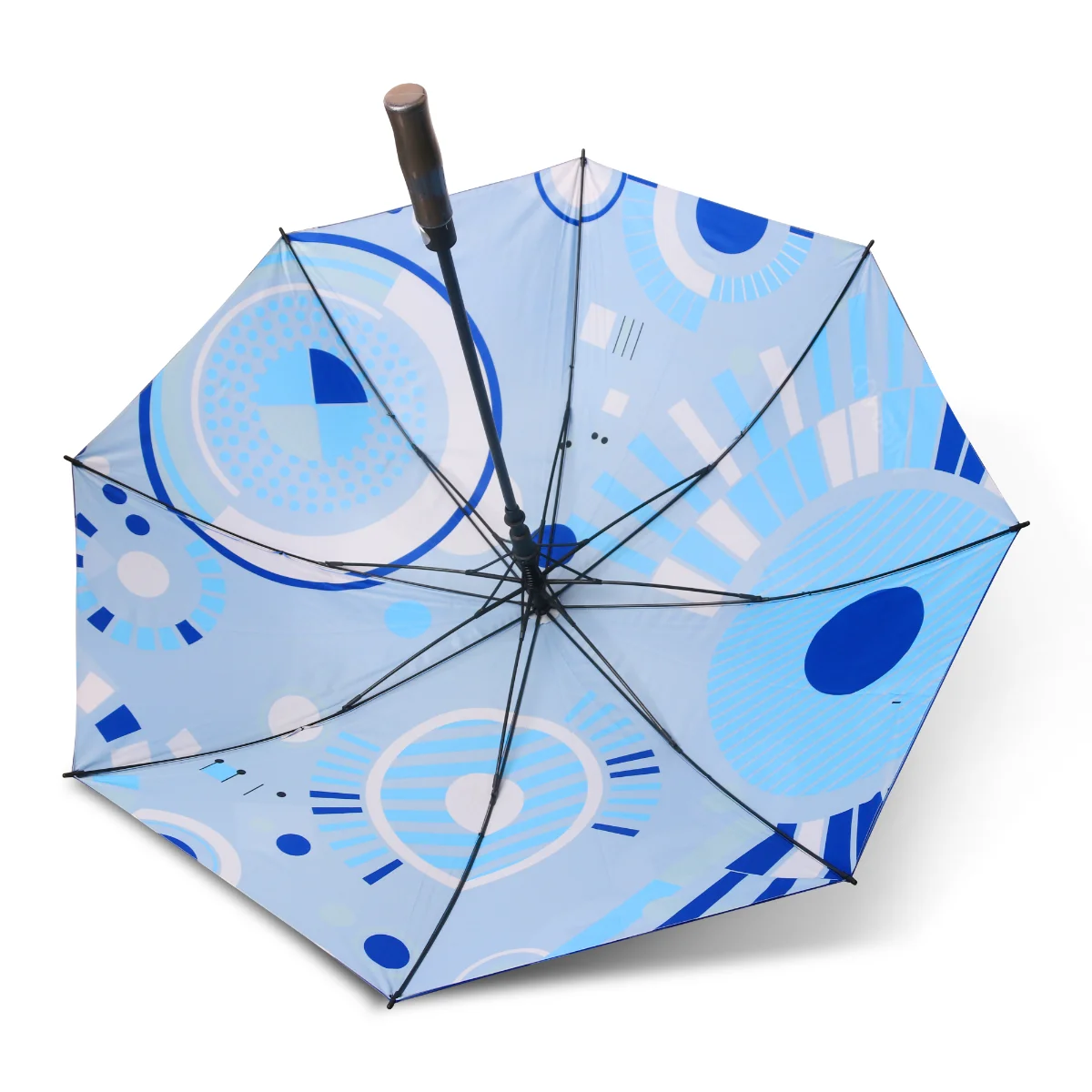 Custom golf umbrella viewed from beneath, with a blue geometric pattern printed on the underside of the canopy